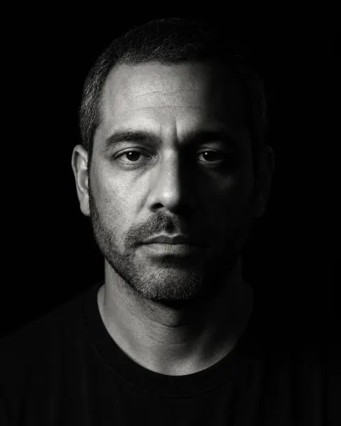Split-Light Studio: a stark black-and-white portrait lit from one side